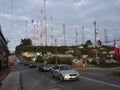 Cars drive past a hill with cell towers in Puerto Mont & x28;Port Mont& x29;, Chile