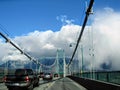 Cars driving across the Lions Gate Bridge, which crosses from Stanley Park to North Vancouver.