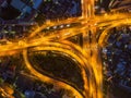 Cars driving on bridge roads shaped curve highways with skyscraper buildings. Aerial view of Expressway Bangna, Klong Toey in