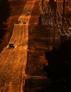 Cars Driving on County Road at Sunset or Sunrise