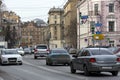 Cars driving down city street, Saint Petersburg, buildings