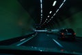 Cars driving fast through modern European tunnel. Switzerland Royalty Free Stock Photo