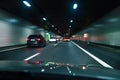 Cars driving fast through modern European tunnel. Switzerland Royalty Free Stock Photo