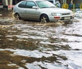 Car driving flood city road Royalty Free Stock Photo