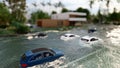 Cars driving on a flooded road during a flood caused by heavy rain 3d rendering Royalty Free Stock Photo