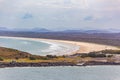 Cars driving on Gallows Beach at Coffs Harbour.