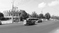 cars driving on the Grigore Vieru Boulevard with Ikarus buses