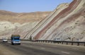 Cars driving on the highway through beautiful colorful mountains in Tabriz, Iran
