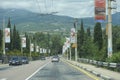 Cars driving the highway, mountains on a background