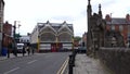 Cars driving past Stockport town Market Hall