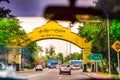 Cars driving on road and welcome sign in Yangon