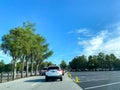 Cars driving into a Walt Disney World Resorts parking lot in Orlando, FL