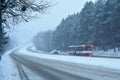 Cars in the fog. Bad winter weather and dangerous automobile traffic on the road. Light vehicles in fog. Royalty Free Stock Photo