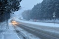 Cars in the fog. Bad winter weather and dangerous automobile traffic on the road. Light vehicles in fog. Royalty Free Stock Photo