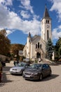 The cars in front of the Heart of Jesus Church Tokaji Jezus szive templom in the center of Tokaj wine region Royalty Free Stock Photo