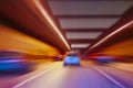 Cars go in lit tunnel Royalty Free Stock Photo