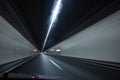 Cars on a highway going through a long modern tunnel Royalty Free Stock Photo