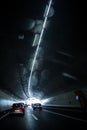 Cars on a highway going through a long modern tunnel Royalty Free Stock Photo