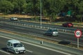 Cars on highway with heavy traffic and SPEED LIMIT sign in Madrid