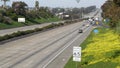 Cars on interstate highway California USA. Intercity freeway transport. Road traffic and greenery. Royalty Free Stock Photo