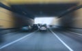 Cars leaving tunnel in downtown Royalty Free Stock Photo