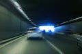 Cars leaving tunnel in downtown Royalty Free Stock Photo