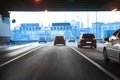 cars leaving tunnel in downtown Royalty Free Stock Photo