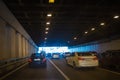 cars leaving tunnel in downtown Royalty Free Stock Photo