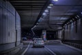 cars leaving tunnel Royalty Free Stock Photo