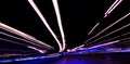 Cars light trails on a curved highway at night. Night traffic trails. Motion blur. Night city road with traffic headlight motion. Royalty Free Stock Photo