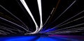 Cars light trails on a curved highway at night. Night traffic trails. Motion blur. Night city road with traffic headlight motion. Royalty Free Stock Photo