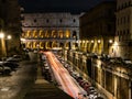 Cars light trails near the Coloseum, Rome, Italy. In Evening Or Night Time. Famous World Landmark. Royalty Free Stock Photo