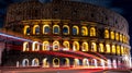 Cars light trails near the Coloseum, Rome, Italy. In Evening Or Night Time. Famous World Landmark. Royalty Free Stock Photo