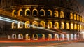 Cars light trails near the Coloseum, Rome, Italy. Also Known As Flavian Amphitheatre In Evening Or Night Time. Famous World Royalty Free Stock Photo