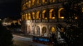 Cars light trails near the Coloseum, Rome, Italy. In Evening Or Night Time. Famous World Landmark. Royalty Free Stock Photo