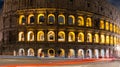 Cars light trails near the Coloseum, Rome, Italy. In Evening Or Night Time. Famous World Landmark. Royalty Free Stock Photo