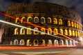 Cars light trails near the Coloseum, Rome, Italy. In Evening Or Night Time. Famous World Landmark. Royalty Free Stock Photo