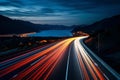 Cars light trails at night in a curve asphalt road at night. Long exposure image of a highway at night Royalty Free Stock Photo
