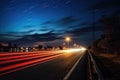 Cars lights in movement on the road at night time. Timelapse, hyperlapse of transportation. Motion blur, light trails Royalty Free Stock Photo