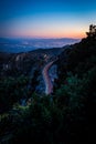 Cars with long exposure driving on the road on Mount Lemmon in the evening in Arizona Royalty Free Stock Photo