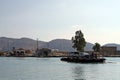 Cars, a motorbike and foot passengers on a cable ferry near Butrint, Albania