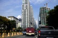 Cars, motorcycles and other vehicles travel along a traffic congested road