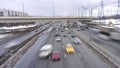 Cars move fast along the busy urban highway. Stressful big city life of dangerous driving concept. Long exposure shot