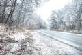 Cars move on winter snowy driving journey on forest road