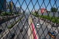 Cars moving fast on a busy multi lane highway in city of Beijing in China