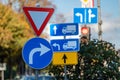 Cars moving on the road in city in autumn. View to the traffic with signs, trafficlights and cars