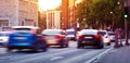 Cars moving on the urban road at dusk Royalty Free Stock Photo