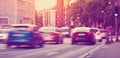 Cars moving on the urban road at dusk