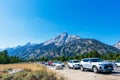 Cars of national park visitors parked along the road