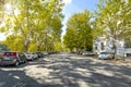 Cars are parked along a tree-lined street in an upscale neighborhood near the Tiber in Rome Italy Royalty Free Stock Photo